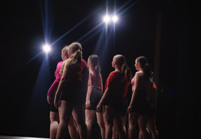 dancers on stage under the lights
