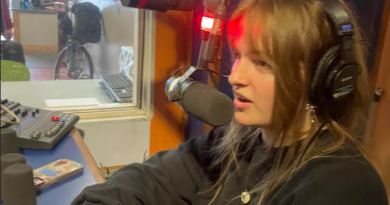 Woman at a radio mic