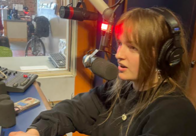 Woman at a radio mic