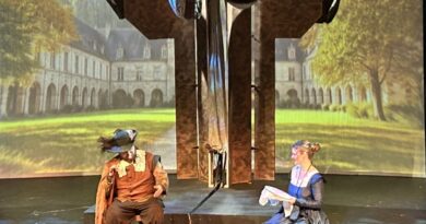 Two actors playing Roxanne and Cyrano on stage