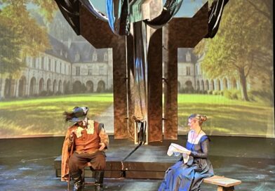 Two actors playing Roxanne and Cyrano on stage