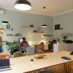 Open office room with two people working at desks