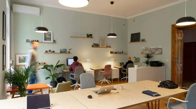 Open office room with two people working at desks