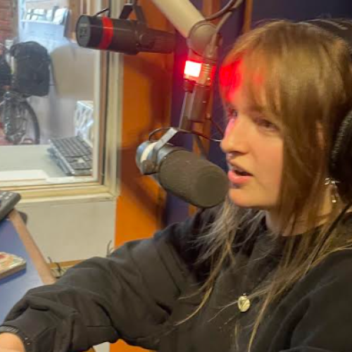 Woman at a radio mic